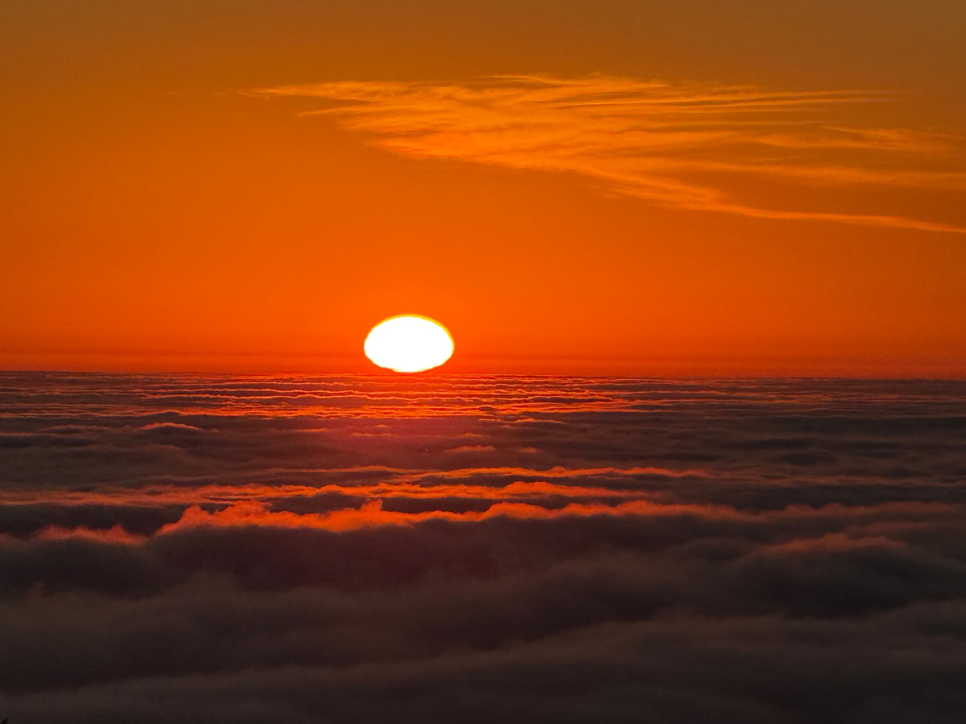 Sunset above a cloud layer